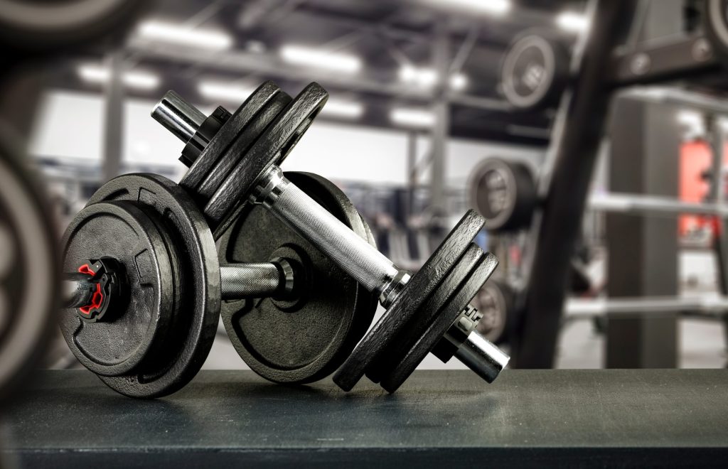 Black desk with gym equipment