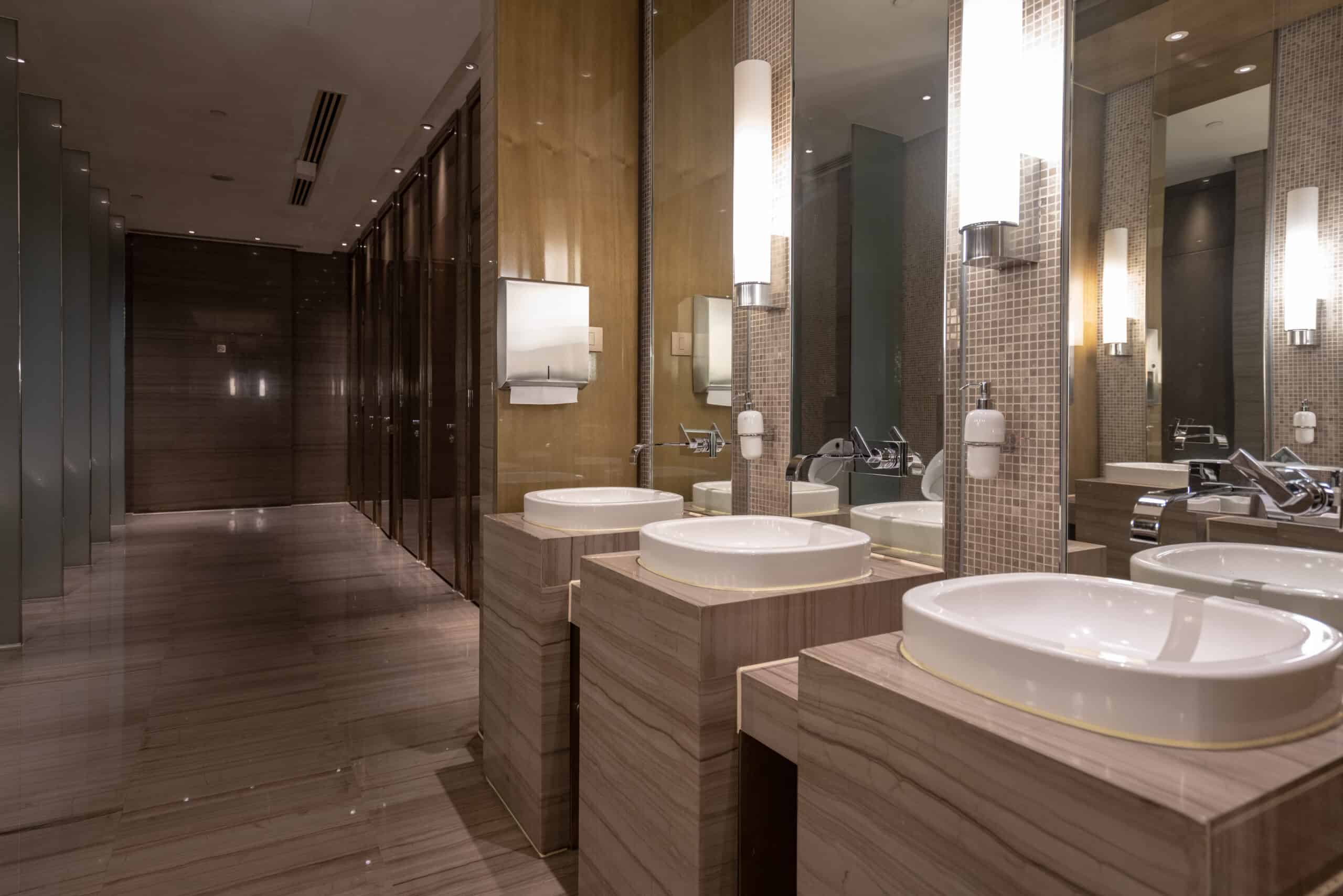 interior of clean bathroom with workplace washroom service